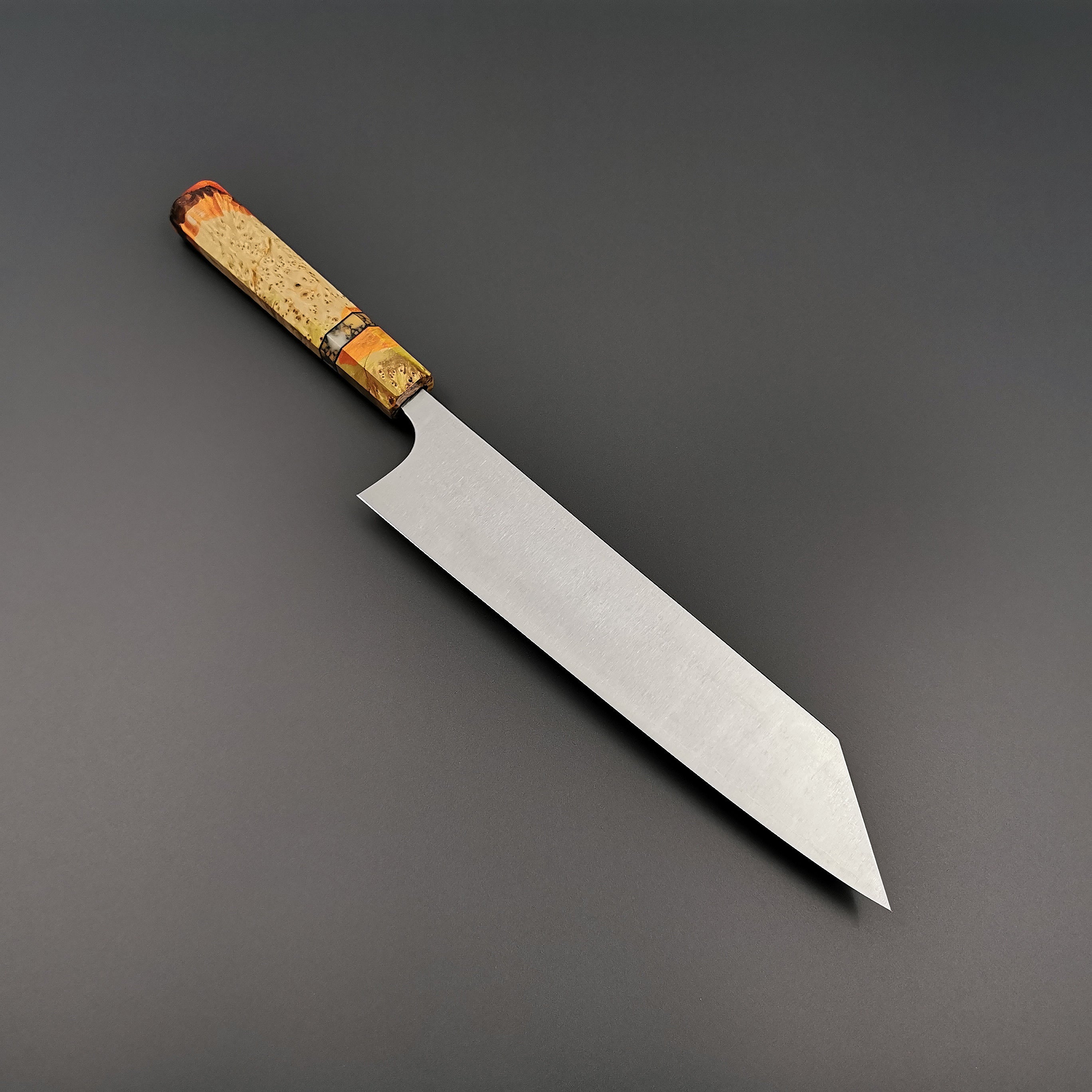 Photo of a chef knife with a custom designed handle