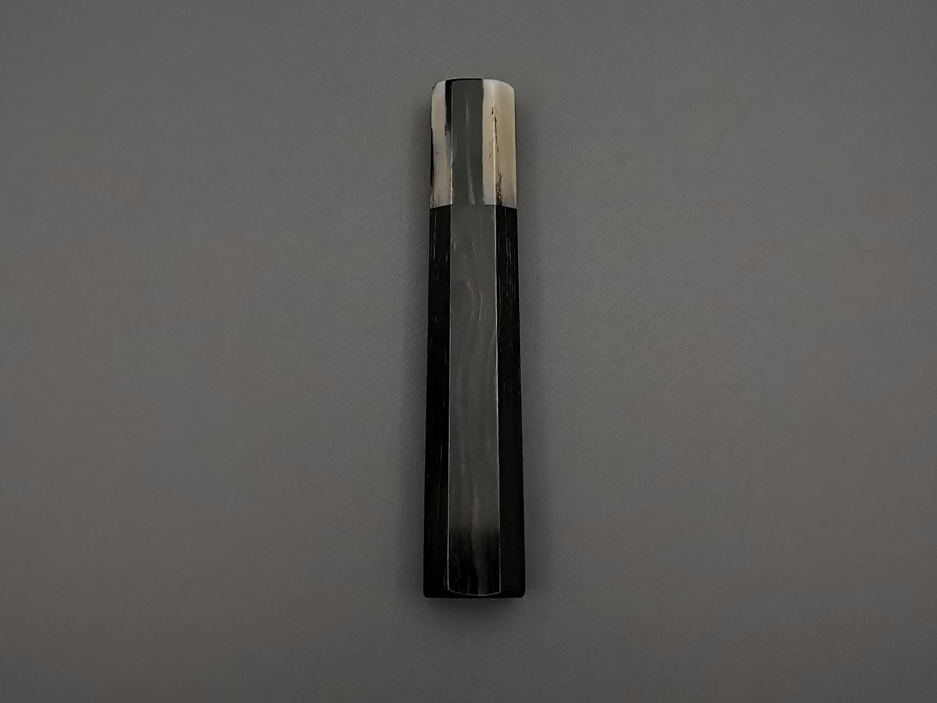 Ebony handle with single marble buffalo horn bolster