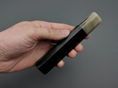 Ebony handle with single marble buffalo horn bolster