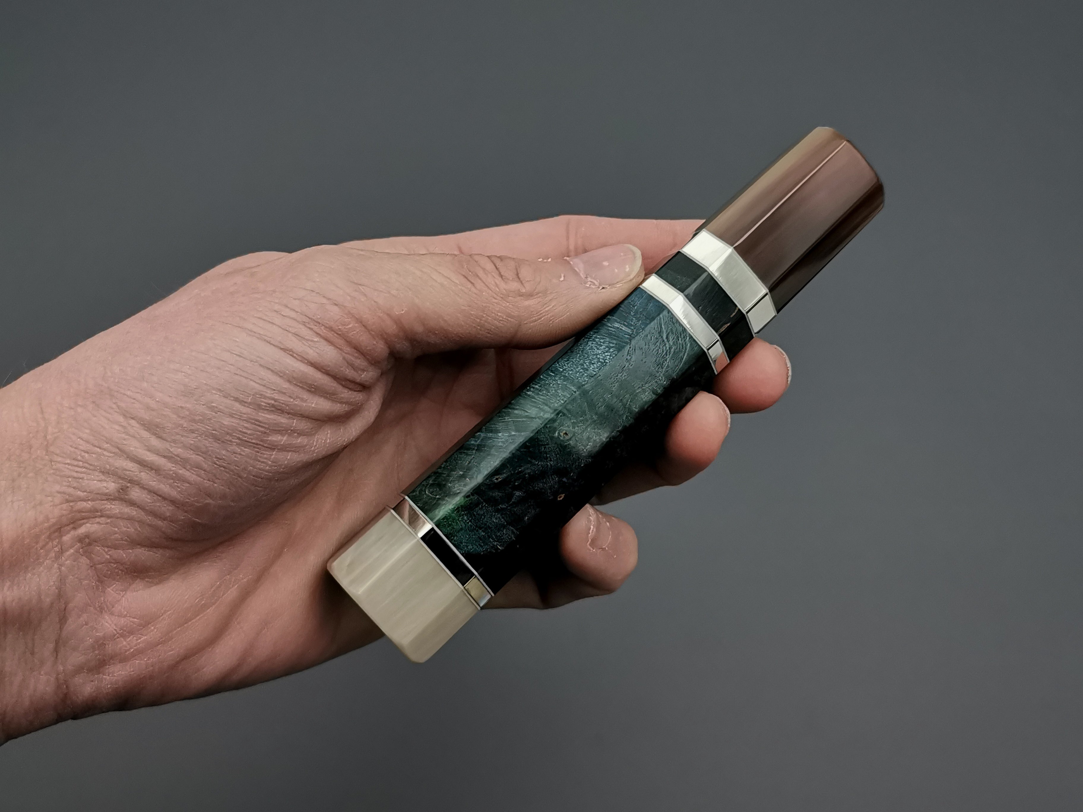 Blue/Green stabilised maple with double marble buffalo horn and triple nickel silver rings