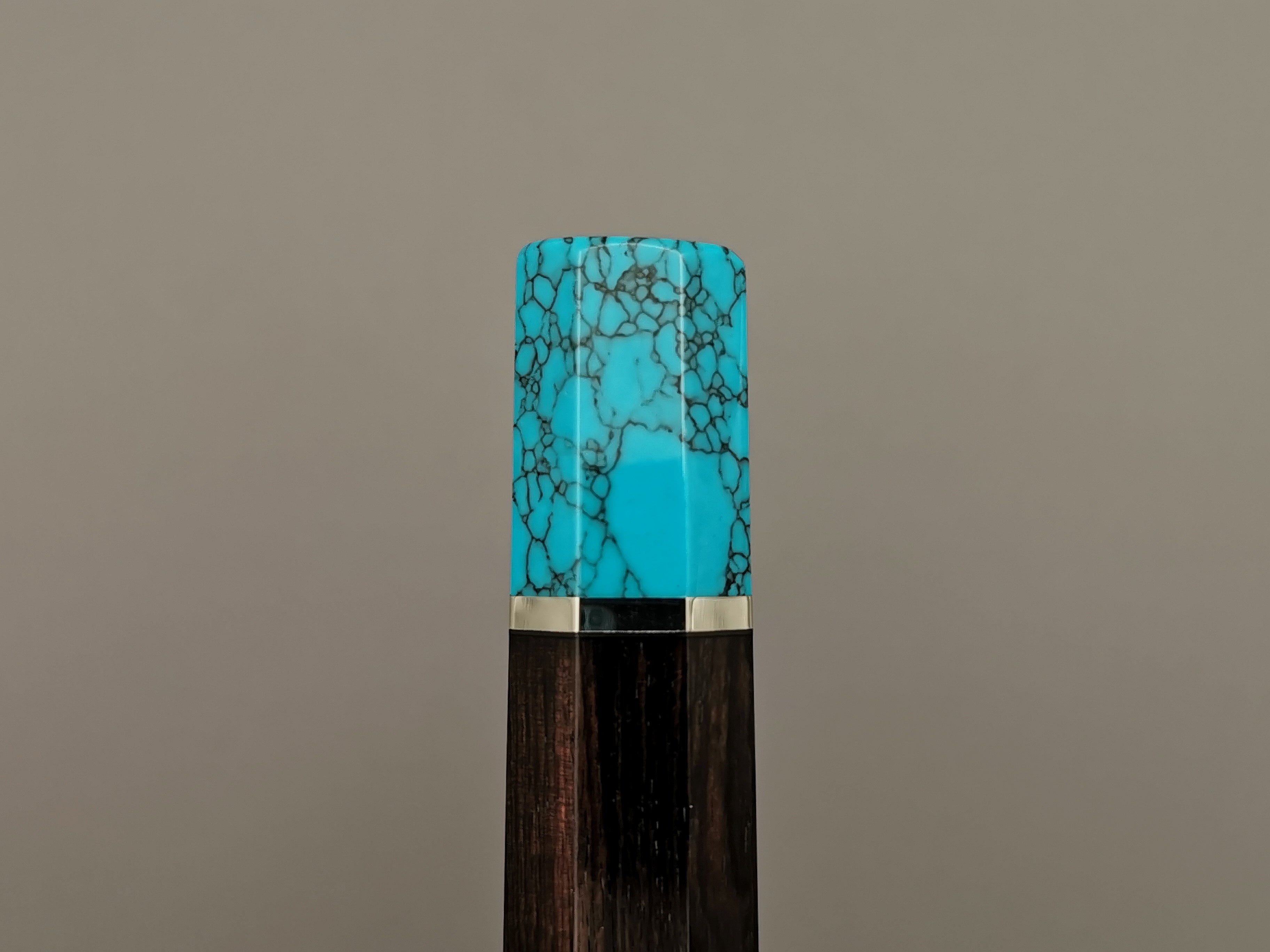 Ebony handle with turquoise bolster